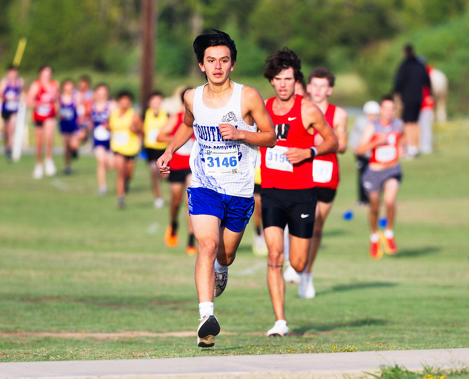 Juan Ramirez competes in the middle of the pack. [see more XC]